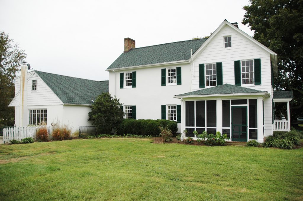 A view of the side yard and the screened porch.