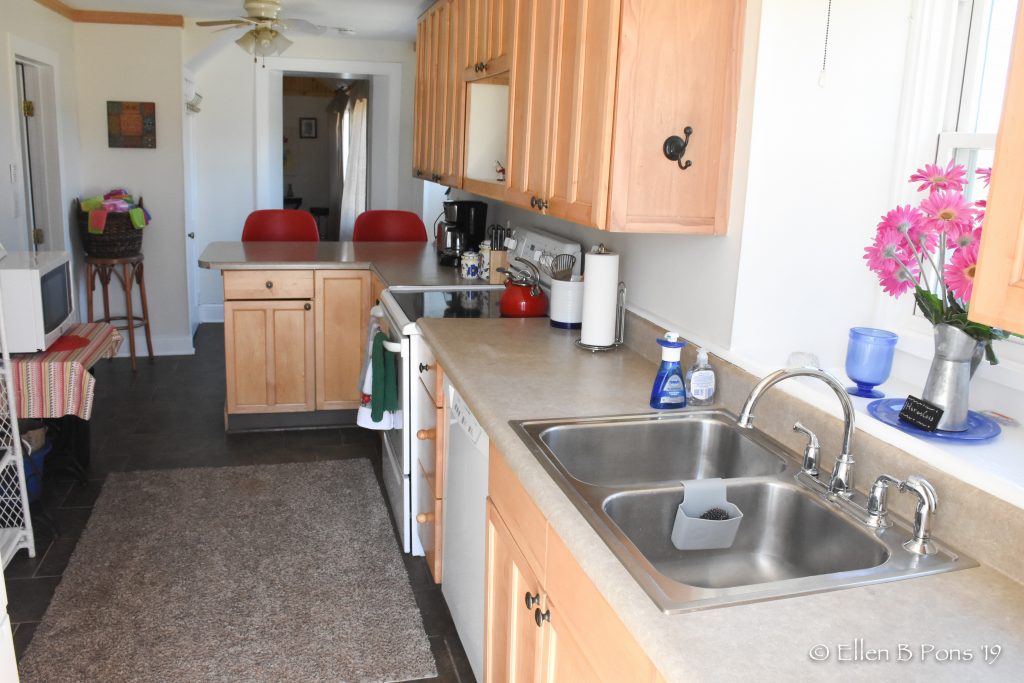 Galley style kitchen is fully equipped for cooking and entertaining.